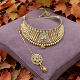 Luxurious gold-tone choker and maang tikka set with matching earrings