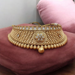 Luxurious gold-tone choker and maang tikka set with matching earrings