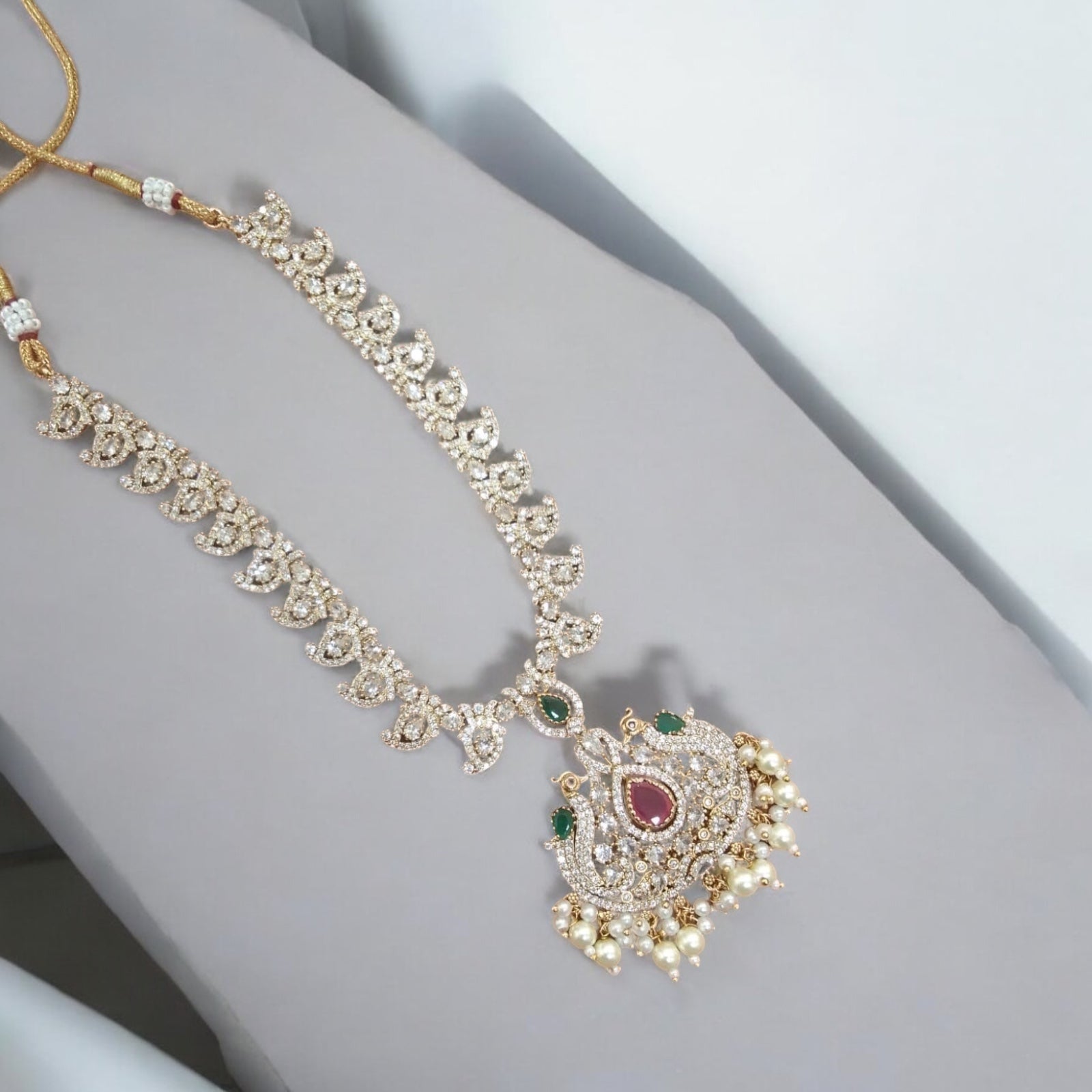 Luxurious Necklace Set with Ruby, Emerald, and Pearl Accents