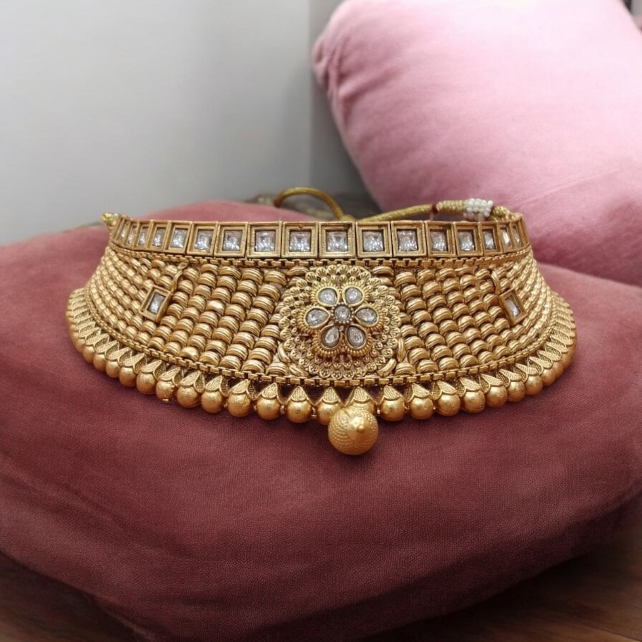 Luxurious gold-tone choker and maang tikka set with matching earrings