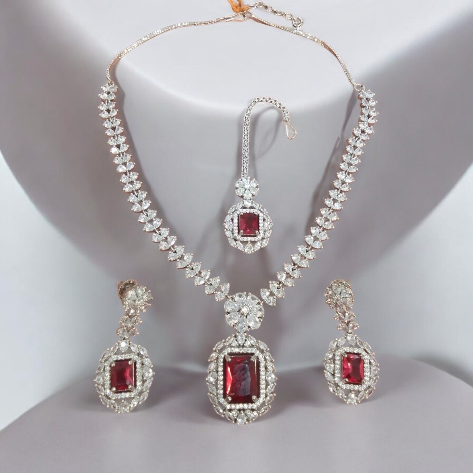 Product Description: Luxurious Silver and Ruby Bridal Jewelry Set