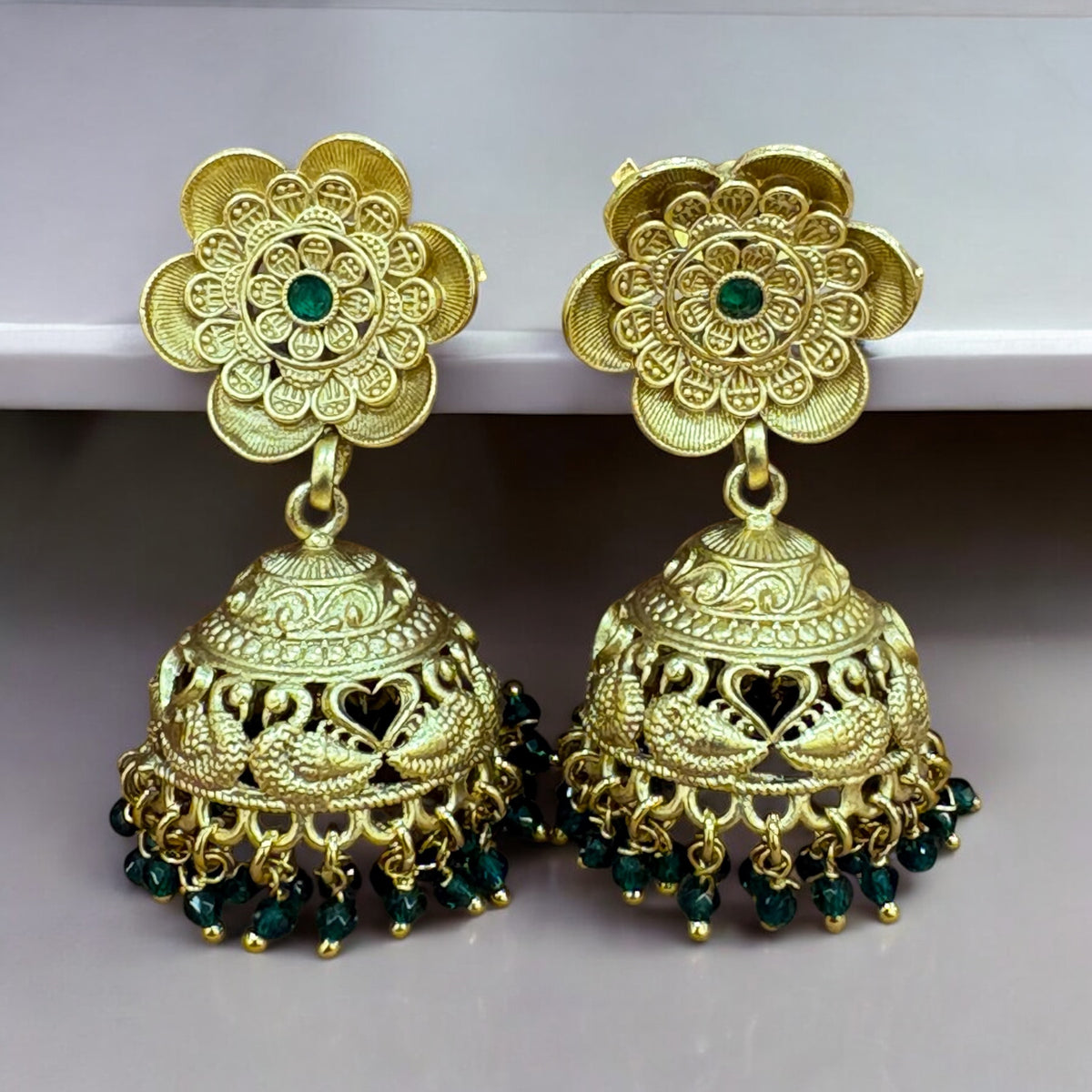 Elegant Gold-Plated Jhumka Earrings with Green Stone Accents